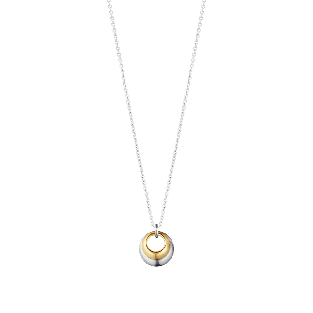 Georg Jensen Curve necklace pairs 18ct yellow gold with sterling silver. Two rounded forms nestle together to create a sculptural biomorphic pendant.