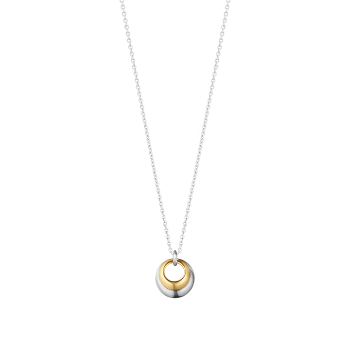 Georg Jensen Curve necklace pairs 18ct yellow gold with sterling silver. Two rounded forms nestle together to create a sculptural biomorphic pendant.