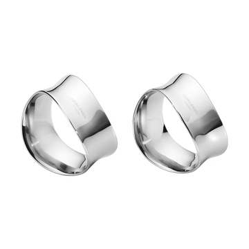 Close-up of the Georg Jensen Cobra Napkin Rings showcasing their sculptural wave-inspired design.