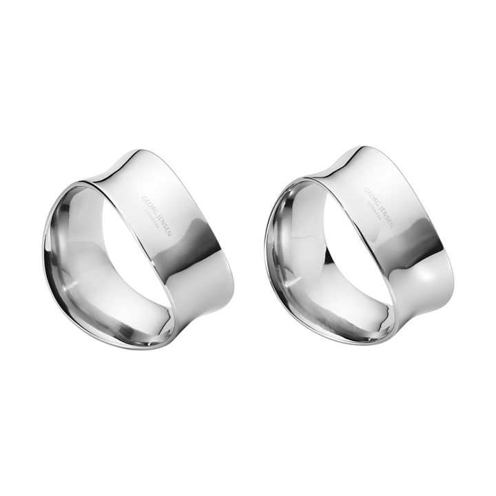Close-up of the Georg Jensen Cobra Napkin Rings showcasing their sculptural wave-inspired design.