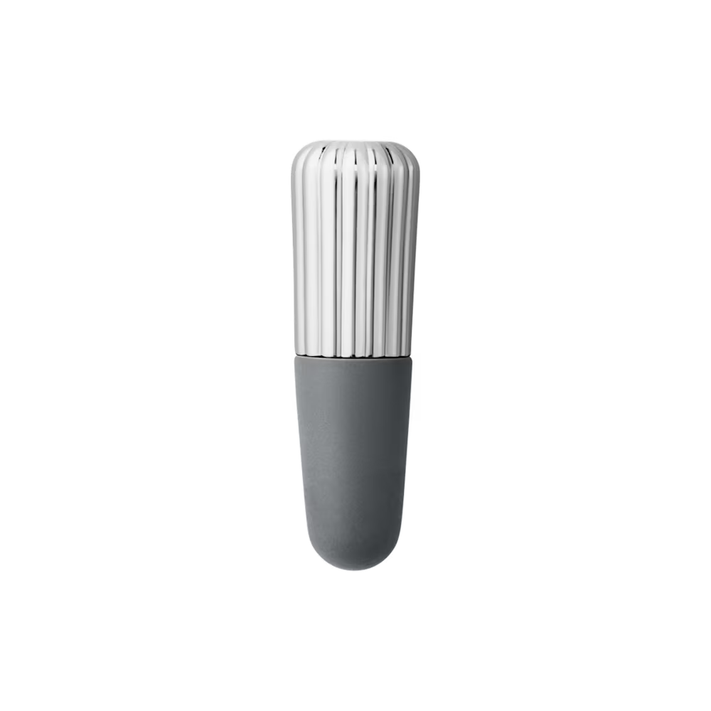 Close-up of the Georg Jensen Bernadotte Wine Stopper showcasing polished stainless steel and iconic grooved detailing.