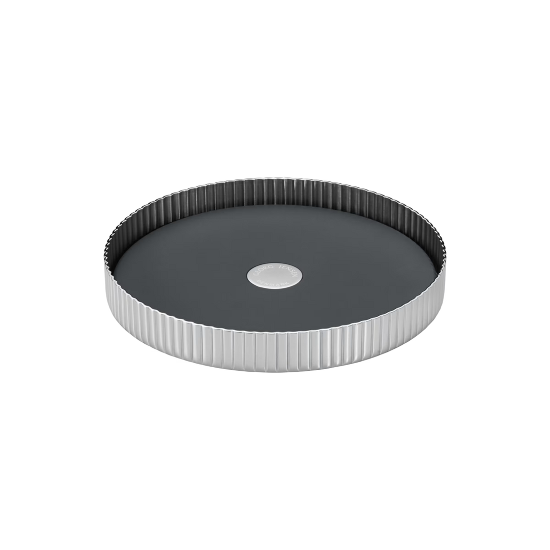 Georg Jensen Bernadotte Wine Coaster in mirror-polished stainless steel with signature grooved design.