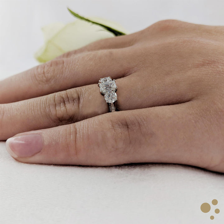 Memoire Emerald Three Stone 0.70ct Diamond Platinum Ring