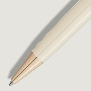 Close-up of the Montblanc Meisterstück Romeo & Juliet ballpoint pen showcasing ivory resin barrel and gold-coated trim