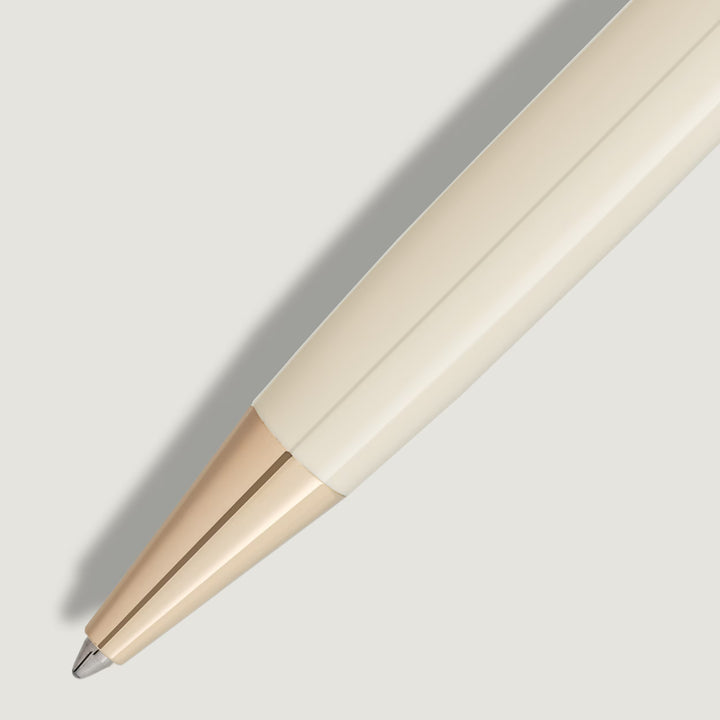 Close-up of the Montblanc Meisterstück Romeo & Juliet ballpoint pen showcasing ivory resin barrel and gold-coated trim
