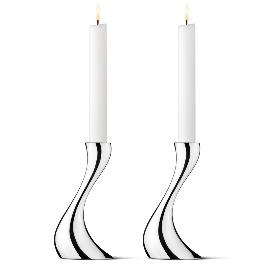 Close-up of the Georg Jensen Cobra Small Candleholders showcasing their flowing mirror-polished stainless steel design.