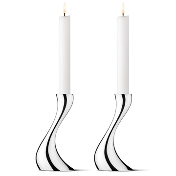 Close-up of the Georg Jensen Cobra Small Candleholders showcasing their flowing mirror-polished stainless steel design.