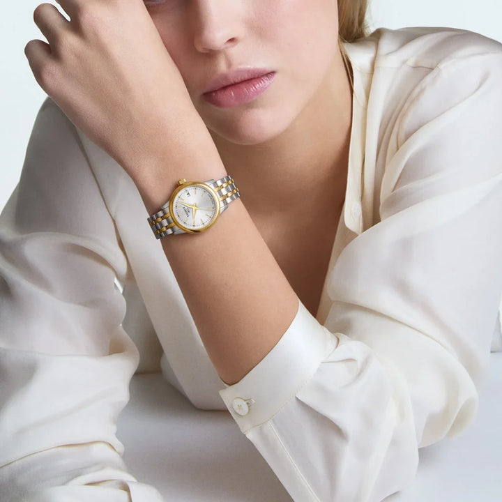 Tissot Classic Dream 28mm watch with silver dial and steel and gold-tone bracelet
