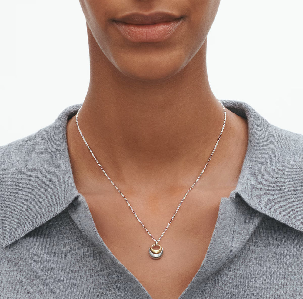Georg Jensen Curve Pendant worn on neck, showing size.