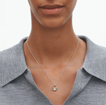 Georg Jensen Curve Pendant worn on neck, showing size.