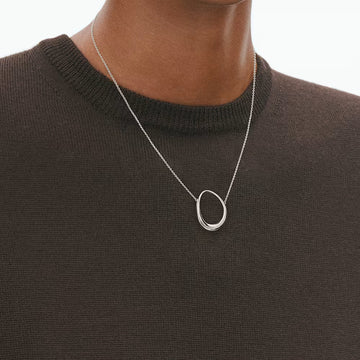 Close Up Georg Jensen Offspring pendant with a sculptural egg-shaped design in sterling silver