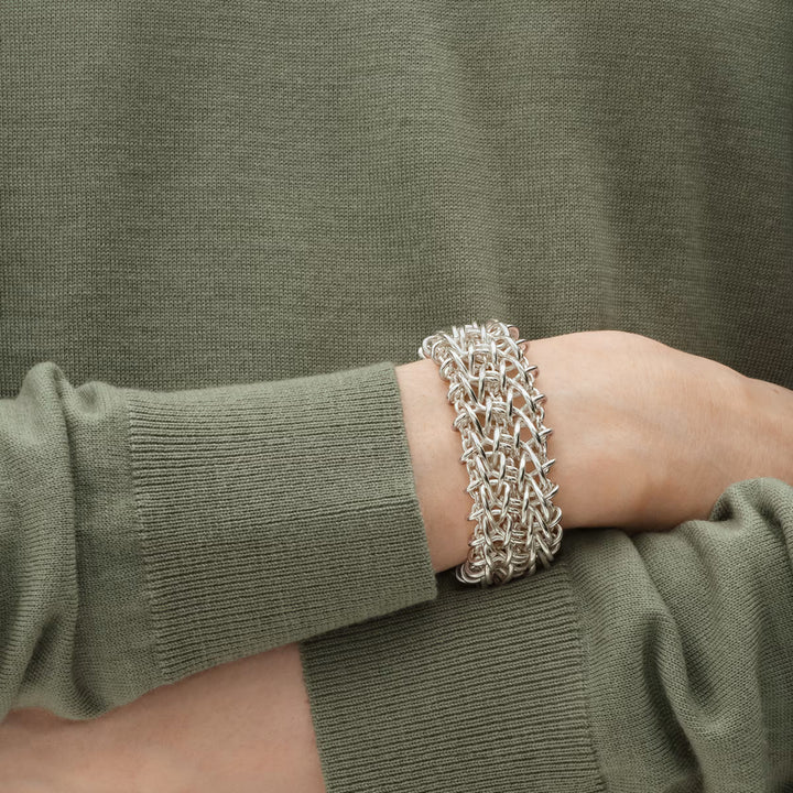 Close-up of the Georg Jensen Weft Triple Link Bracelet showcasing handcrafted silver links and polished finish.