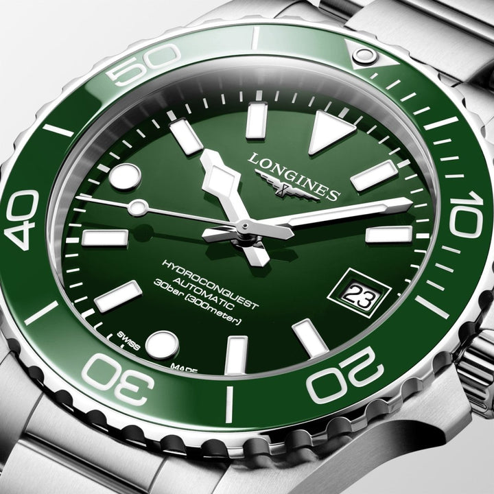 Close-up of Longines HydroConquest watch featuring green face, luminous hands, rotating bezel and stainless steel strap