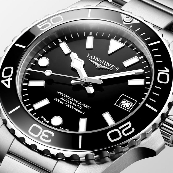 Close-up of Longines HydroConquest watch featuring black face, luminous hands, rotating bezel and stainless steel strap