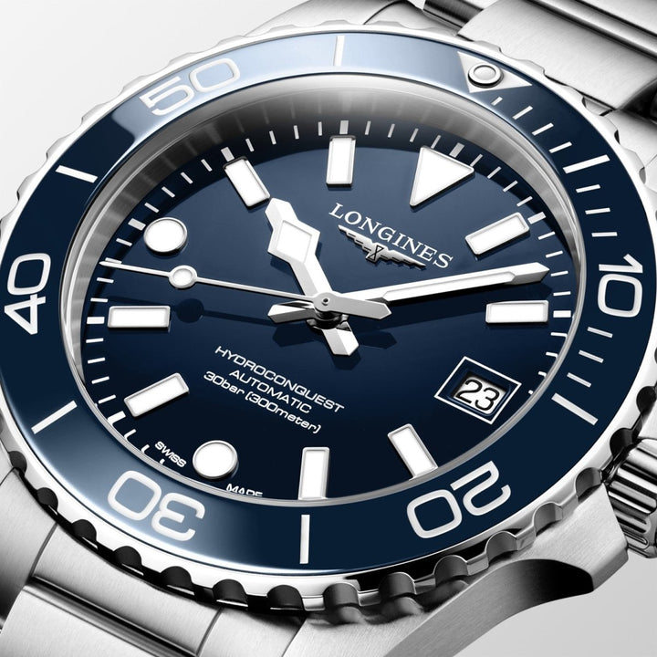 Close-up of Longines HydroConquest watch with blue face, luminous hands, rotating bezel and stainless steel strap