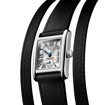 close up of the DolceVita dial and black multi strap wrist strap.