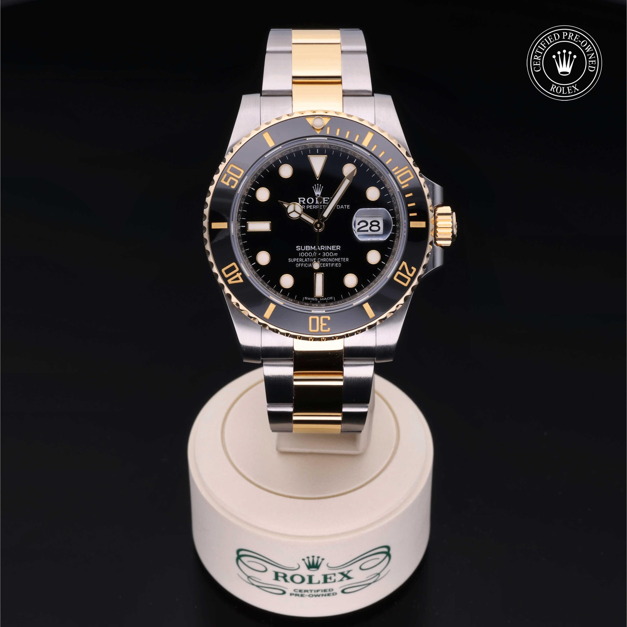 Angled view of the Rolex Certified Pre-Owned Submariner Date M16613 in Oystersteel and yellow gold with black dial and rotating black bezel.