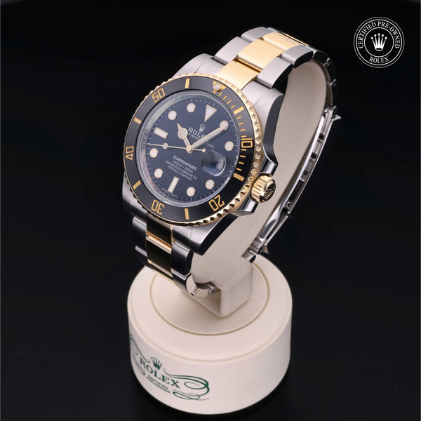Side profile of the Rolex Certified Pre-Owned Rolex Submariner Date M16613 showing the Oystersteel and yellow gold case and Oyster bracelet.