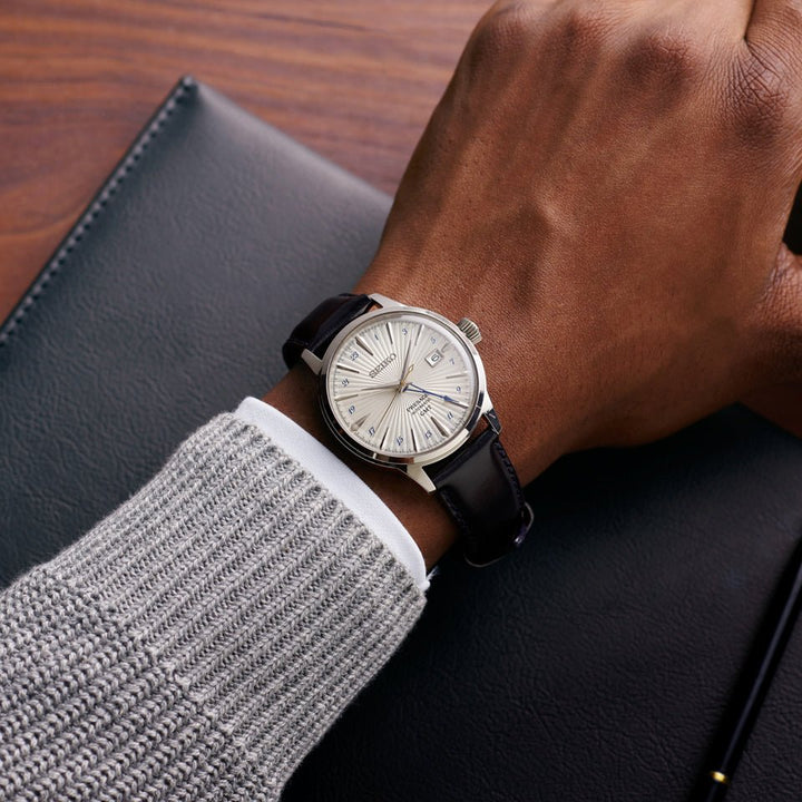 Seiko Presage Cocktail Time Silver Bullet worn on wrist, showing pressed silver dial and brown leather strap
