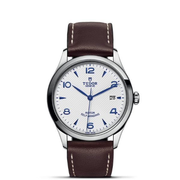 TUDOR 1926 39mm watch with an opaline dial, blue hands and brown leather strap