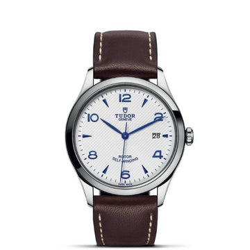 TUDOR 1926 39mm watch with an opaline dial, blue hands and brown leather strap