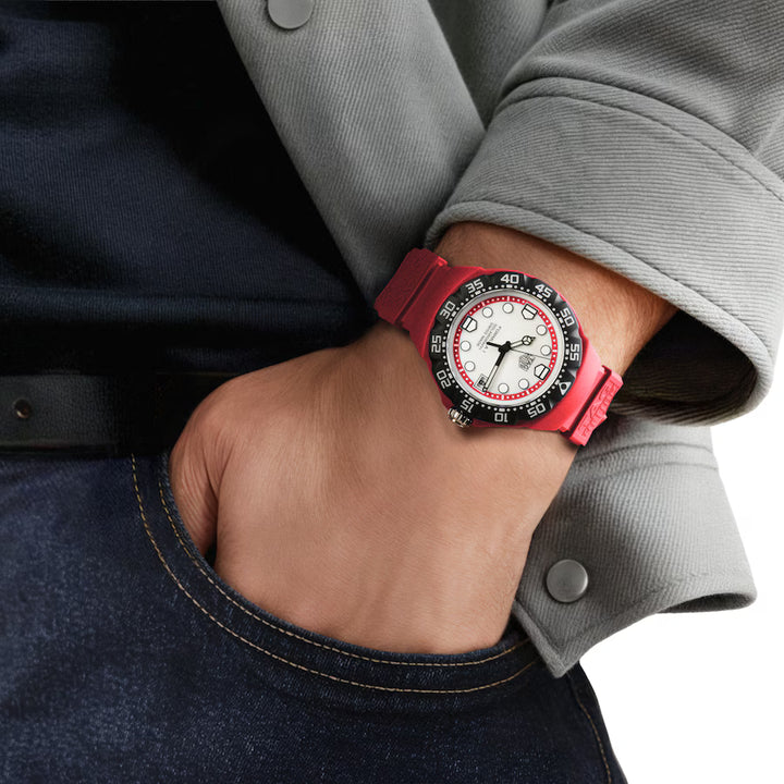 TAG Heuer Solargraph TH50-00 watch with red rubber strap and luminous indexes - worn on wrist