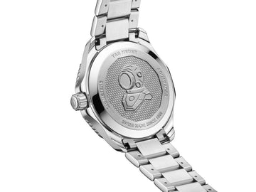 TAG Heuer Aquaracer Professional 300 GMT stainless steel caseback showing engraved diver helmet and Swiss automatic movement