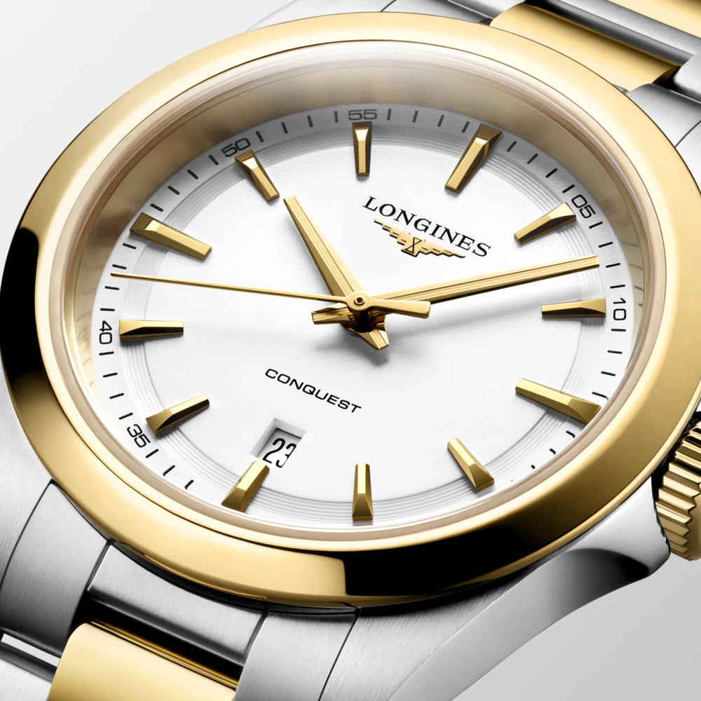 Longines Conquest women's watch featuring a 30mm case, white dial and yellow gold-tone detailing