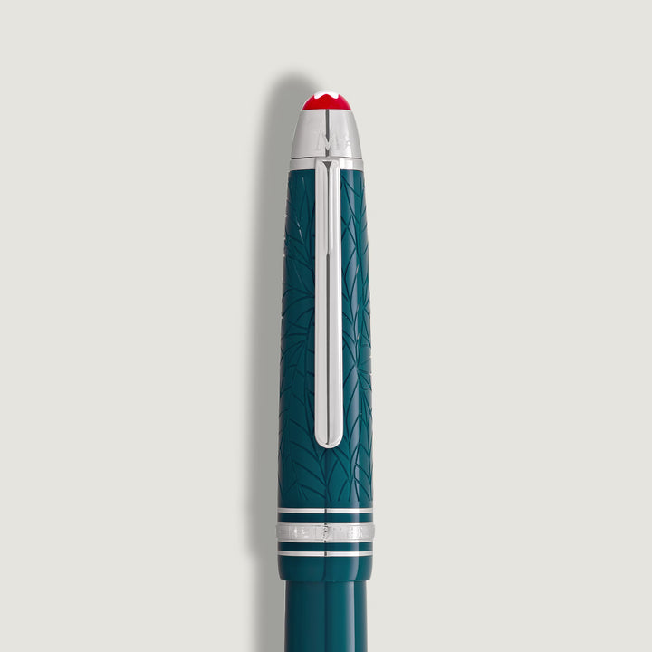 Close-up of the Montblanc Meisterstück Romeo & Juliet LeGrand Rollerball showcasing teal resin barrel and platinum-coated trim.