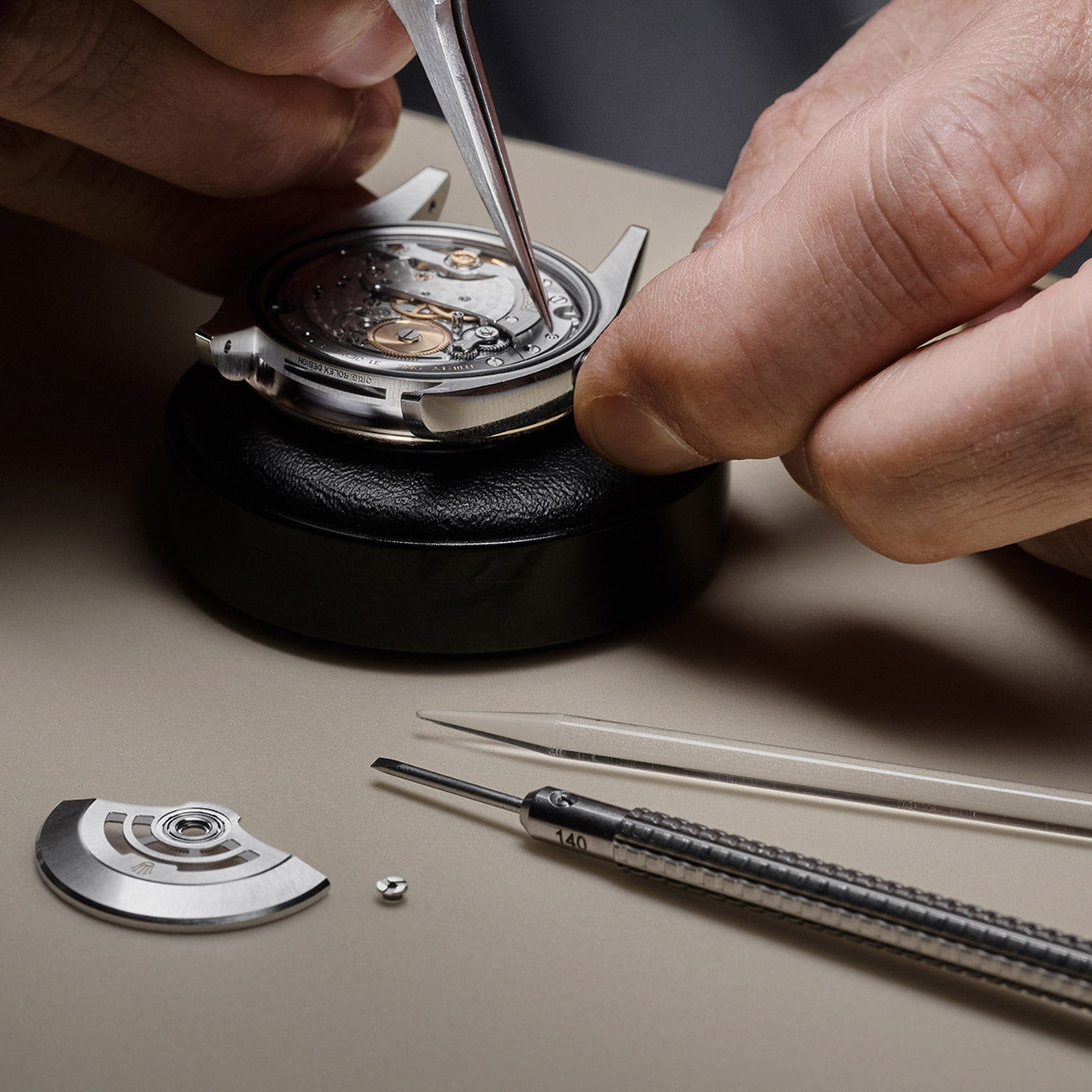 Rolex at Deacons watch maker dismantling watch 