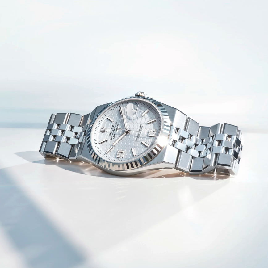 Rolex platinum Land Dweller, integrated bracelet.