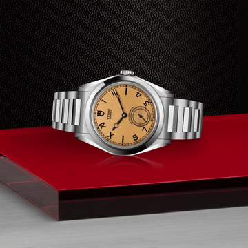 TUDOR Monarch dress watch with champagne dial and integrated steel bracelet