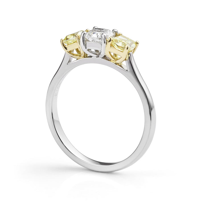 Fancy yellow and white diamond three stone ring