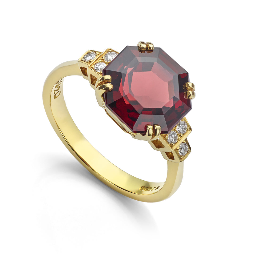 18ct yellow gold garnet ring with diamond shoulders